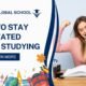 Student studying at a desk feeling motivated and energized, representing tips on how to stay motivated while studying.